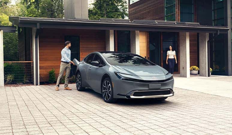 Most Fuel Efficient Toyota Models at Palmiero Toyota | Man charging his parked Toyota Prius at home 