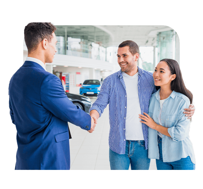 Defining GAP Insurance at Palmiero Toyota in Meadville, PA | Couple shaking hands with sales person at dealership