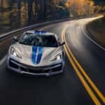 A silver 2024 Chevy Corvette E-Ray 3LZ is shown on wet pavement after leaving a Chevrolet dealer near you.