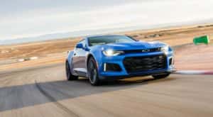 A blue 2017 Chevy Camaro ZL1 is shown on a racetrack after visiting a Chevrolet dealer in South Jordan, UT.