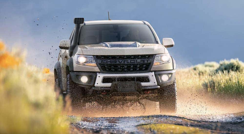 A tan 2022 Chevy Colorado ZR2 Bison Edition is shown off-roading.