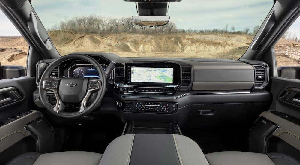 The black and grey interior of a 2024 Chevy Silverado 2500 HD ZR2 is shown from above the center console.