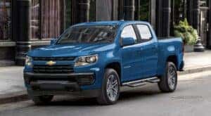 A blue 2022 Chevy Colorado is shown parked on a street.