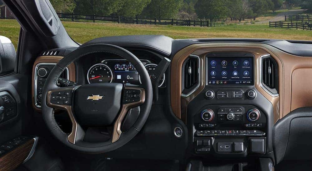 A close up shows the brown and black dash on a Used Chevy Silverado 1500 For Sale - 2021 used Chevy Silverado 1500 for sale.
