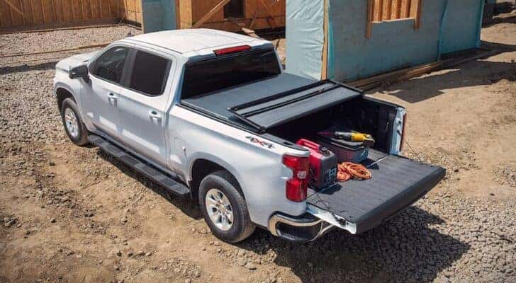 A silver 2022 Chevy Silverado 1500 LTD is shown from above at a construction site.