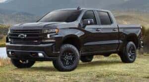 A black 2021 Chevy Silverado 1500 Z71 Trail Boss is shown from the front at an angle.