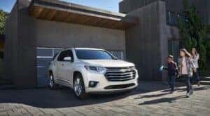 A white 2021 Chevy Traverse is shown from the front at an angle in a driveway.