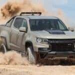 A tan 2021 Chevy Colorado ZR2 is shown from the front after leaving a dealer that has used Chevy trucks for sale.