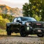 A black 2020 GMC Sierra 1500 SLE Elevation is shown parked on a trail.