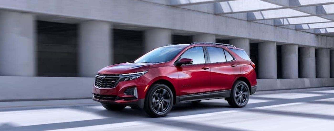 A red 2022 Chevy Equinox RS is shown from the side.