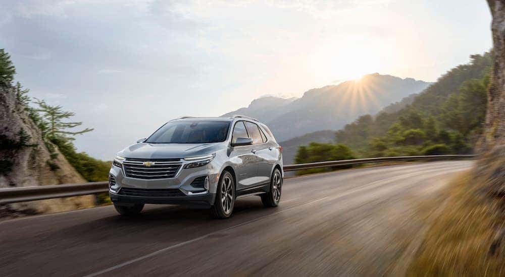 A grey 2023 Chevy Equinox is shown from the front at an angle.