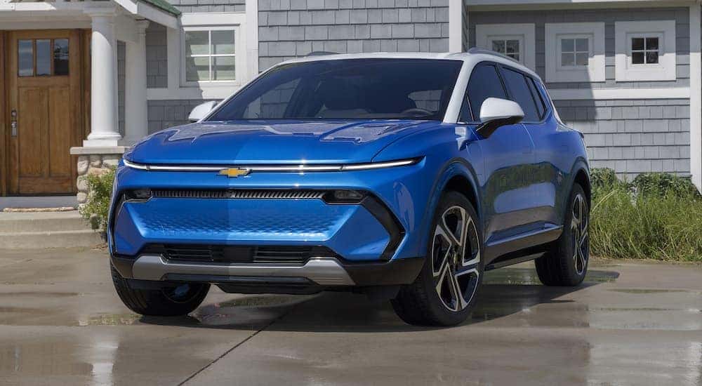 A blue 2024 Chevy Equinox EV 3LT is shown from the front at an angle.