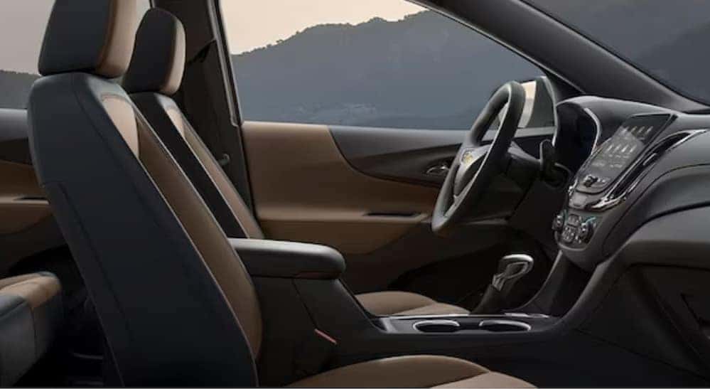 The black and brown interior in a Chevy Equinox for sale near Draper is shown.