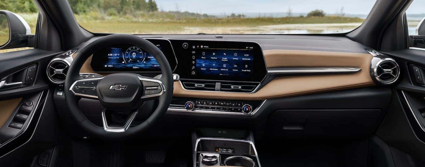The tan interior of a 2025 Chevy Equinox Activ is shown from above the center console.