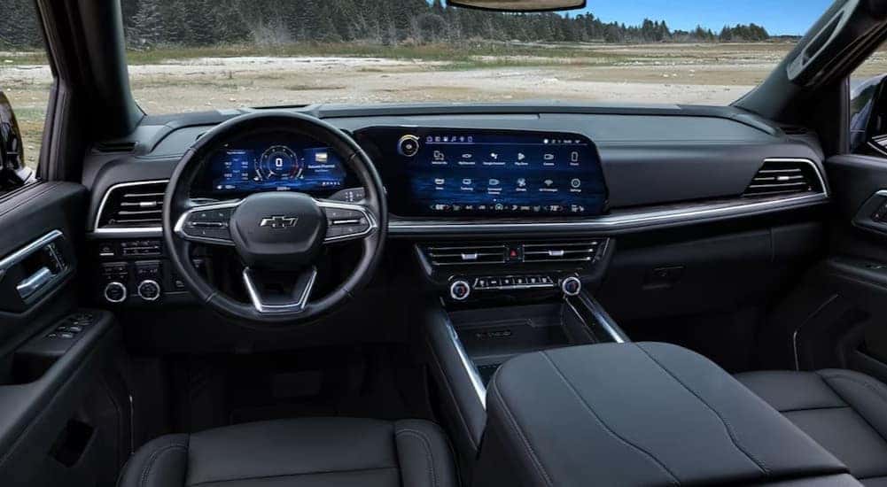 The black interior and dash in a 2025 Chevy Tahoe for sale is shown.