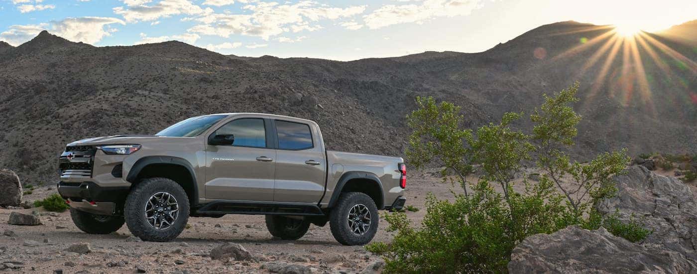 A tan 2024 Chevy Colorado ZR2 parked in the desert.