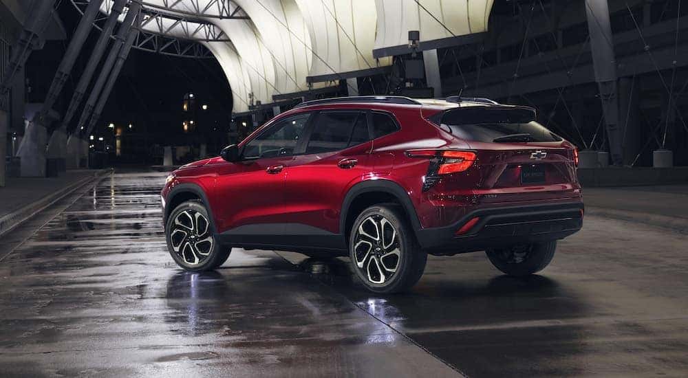 A red 2025 Chevy Trax RS is shown from the rear at an angle.