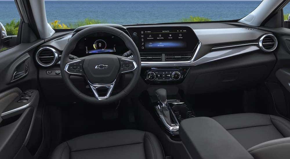 The black interior and dashboard of a 2025 Chevy Trax.