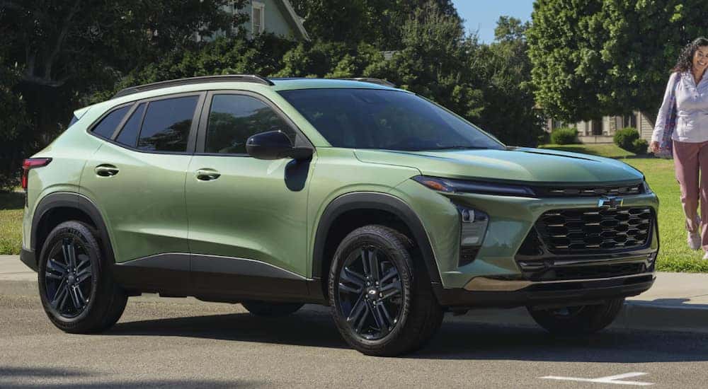 A green 2025 Chevy Trax parked and angled right.