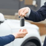 sales rep handing customer car key