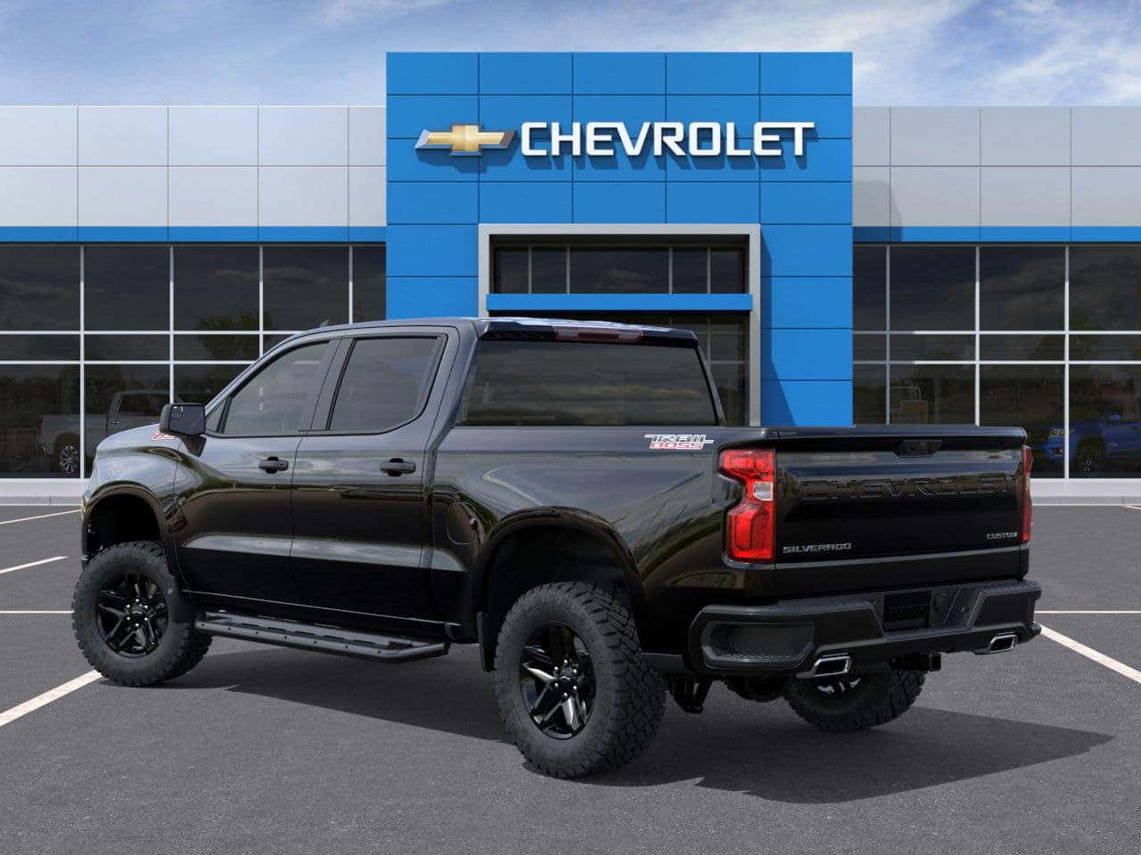 Chevy Silverado Custom Trail Boss driving off-road near Mobile, Alabama
