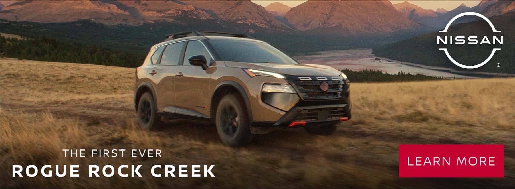 Tan 2025 Nissan Pathfinder outside in front of mountains