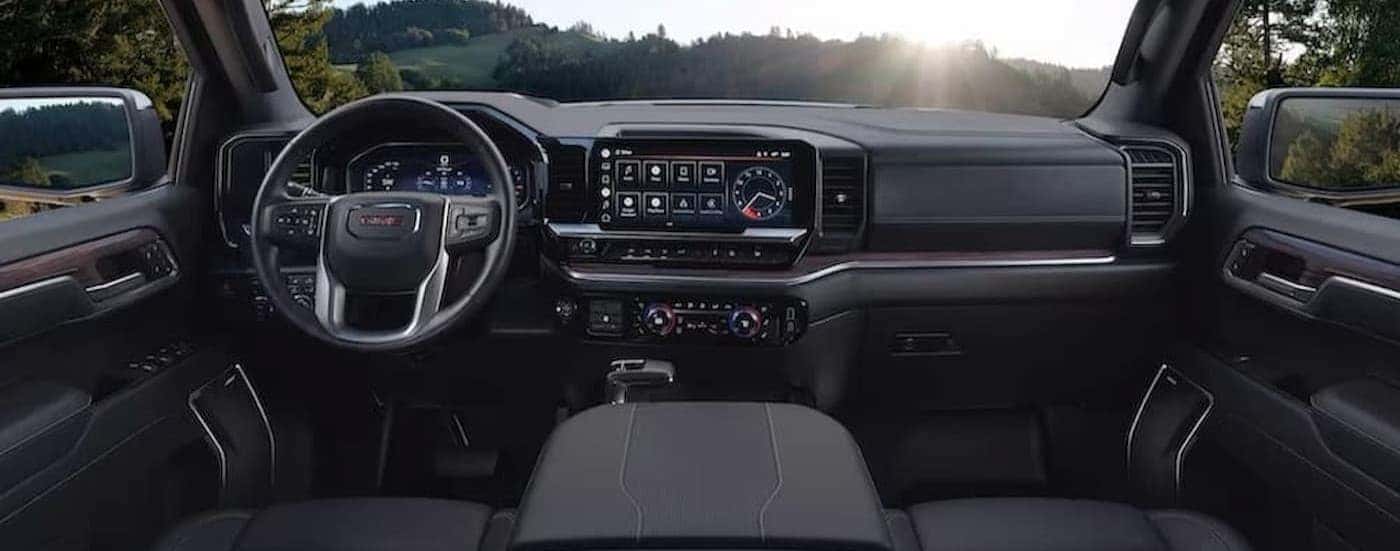 The gray interior and dash in a 2023 GMC Sierra 1500 is shown.