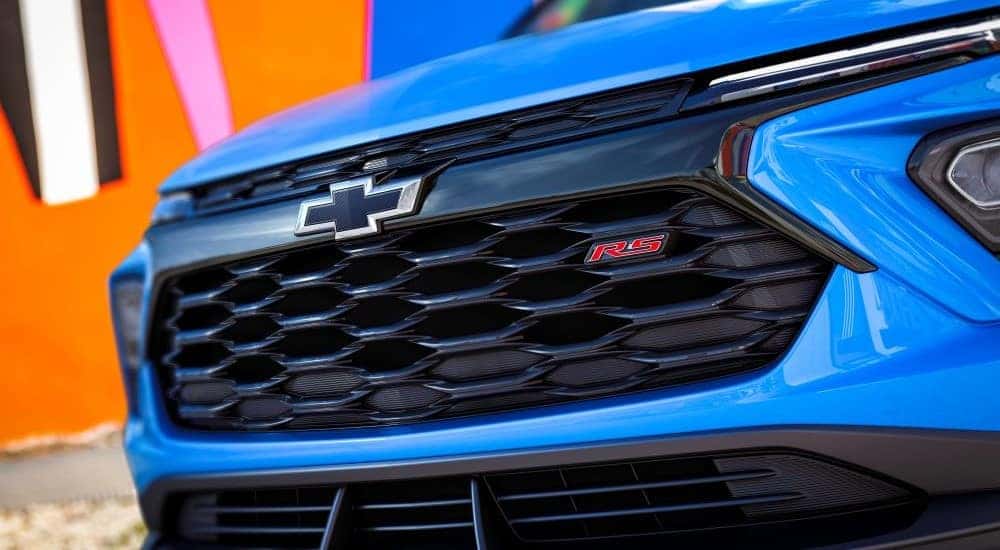A close-up on the grille of a blue 2024 Chevy Trailblazer RS.