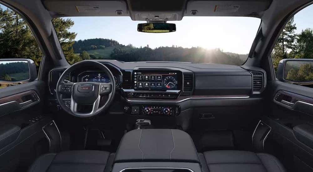 The black interior and dash in a 2023 GMC Sierra 1500 is shown.
