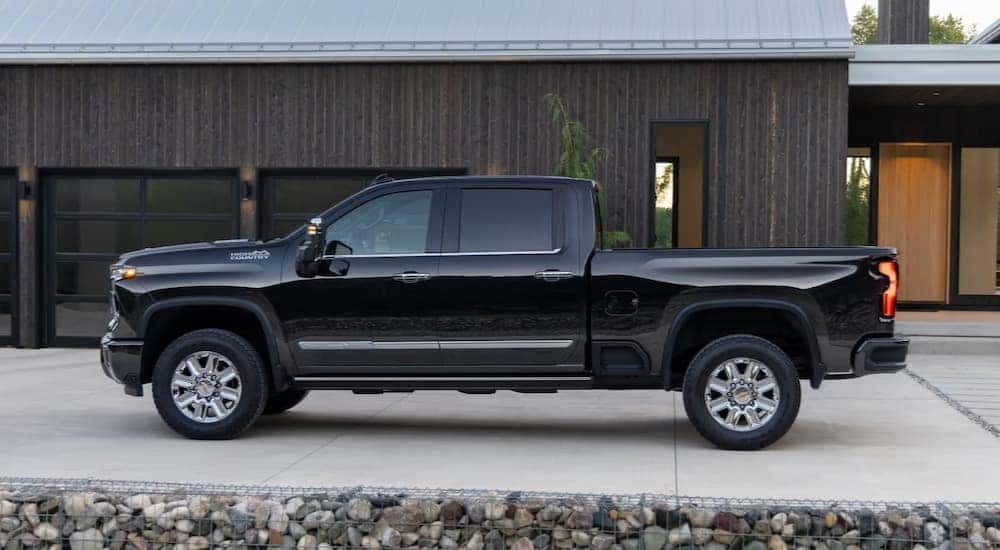 A black 2025 Chevy Silverado 2500 HD High Country is shown parked after viewing a Chevy Silverado for sale.