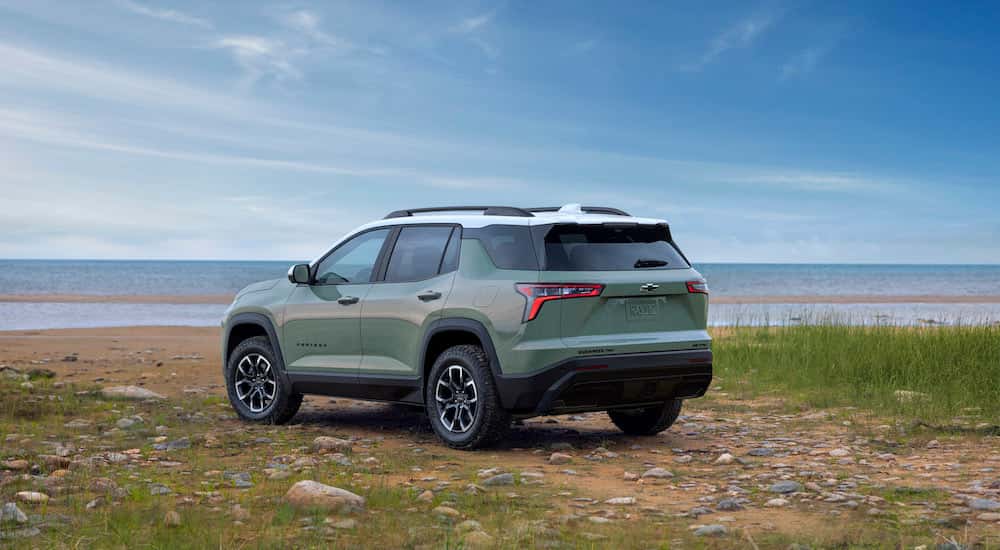 A green 2025 Chevy Equinox ACTIV parked off-road.