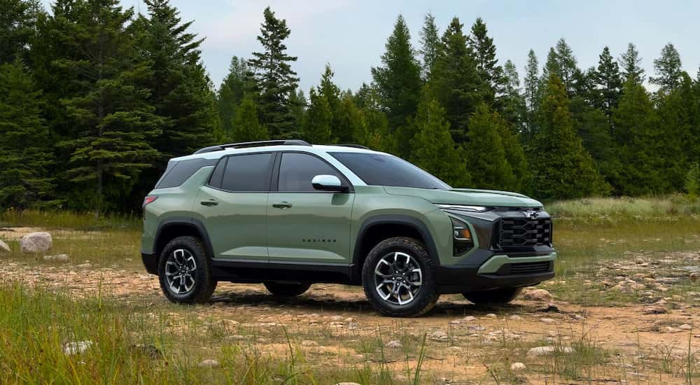 A green 2025 Chevy Equinox ACTIV parked off-road.
