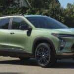A green 2025 Chevy Trax ACTIV is parked on a sunny day.