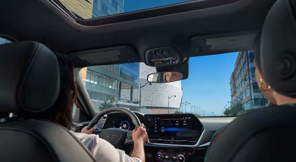 People driving in a 2025 Chevy Trax for sale.