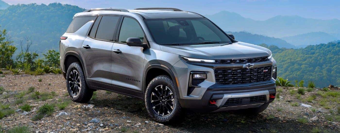 A grey 2024 Chevy Traverse Z71 is shown parked at an overlook.