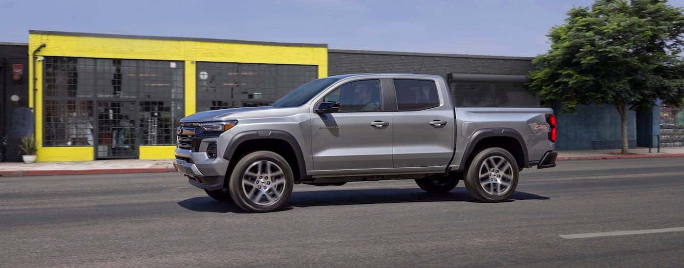 A silver 2024 Chevy Colorado Z71 is shown from the side after leaving a Chevy dealer near me.