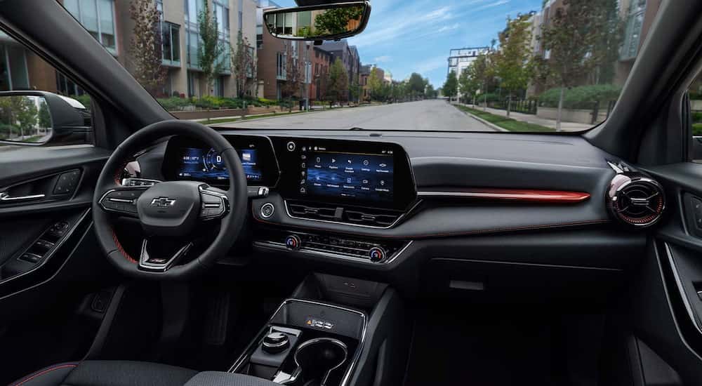 Black interior and infotainment system on a 2026 Chevy Equinox.