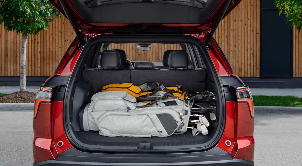 Golf clubs in the trunk of a red 2026 Chevy Equinox for sale near Danville.