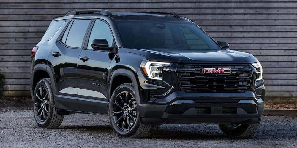 2026 GMC Terrain Black Edition parked in front of a building.