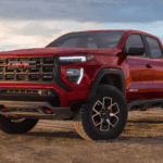 Red 2026 GMC Canyon AT4X for sale parked off-road
