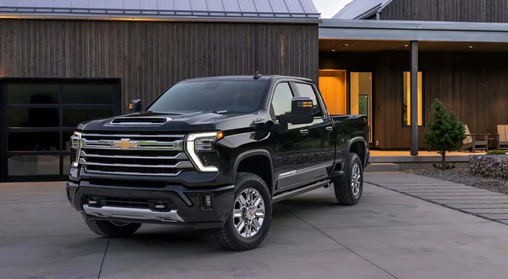 Black 2026 Chevy Silverado 2500 HD parked in a driveway