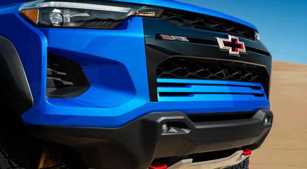 Close up of the grille on a blue 2026 Chevy Colorado.