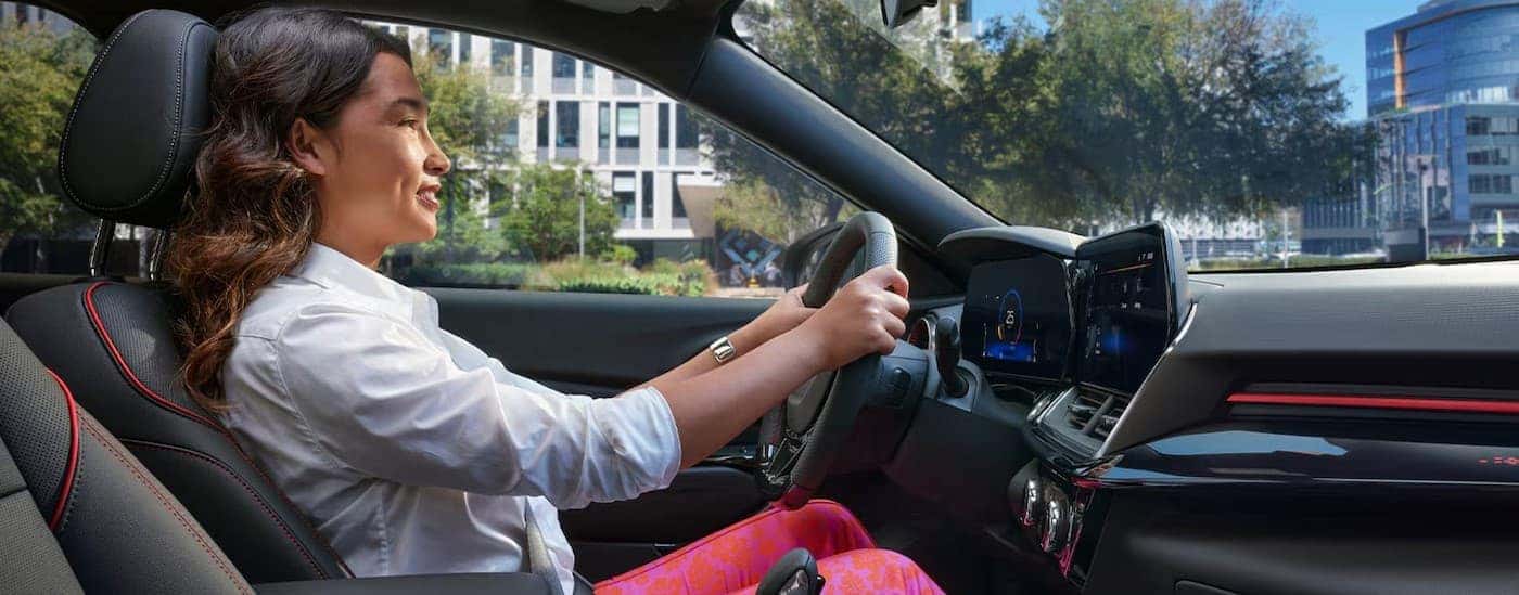 A person driving in a 2026 Chevy Trax.