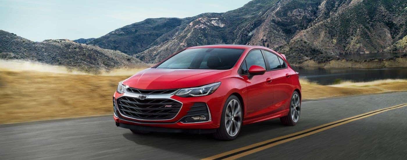 Red 2019 Chevy Cruze RS driving by mountains